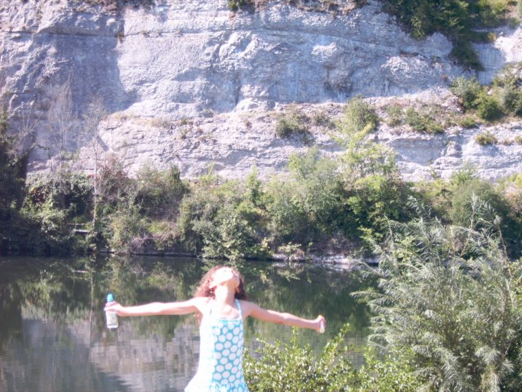 Girl with arms stretched out showing confidence